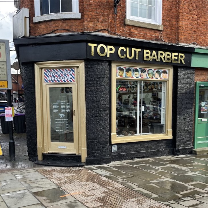 Completed black and gold painted shopfront for Top Cut Barber